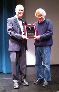 A person holding a plaque with a person in a blue shirt
AI-generated content may be incorrect.